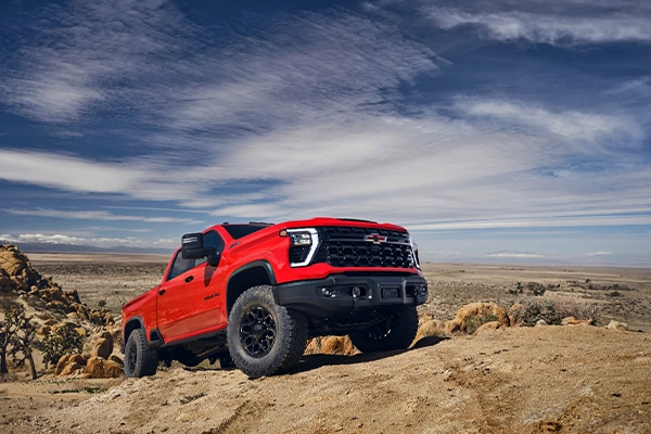 Red Chevy truck off-roading
