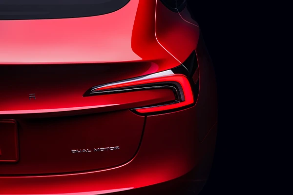 Back of red dual-motor Tesla Model 3