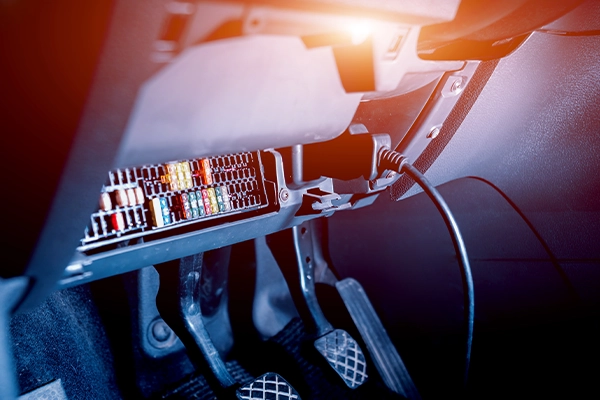 exposed fuses and relays inside a car